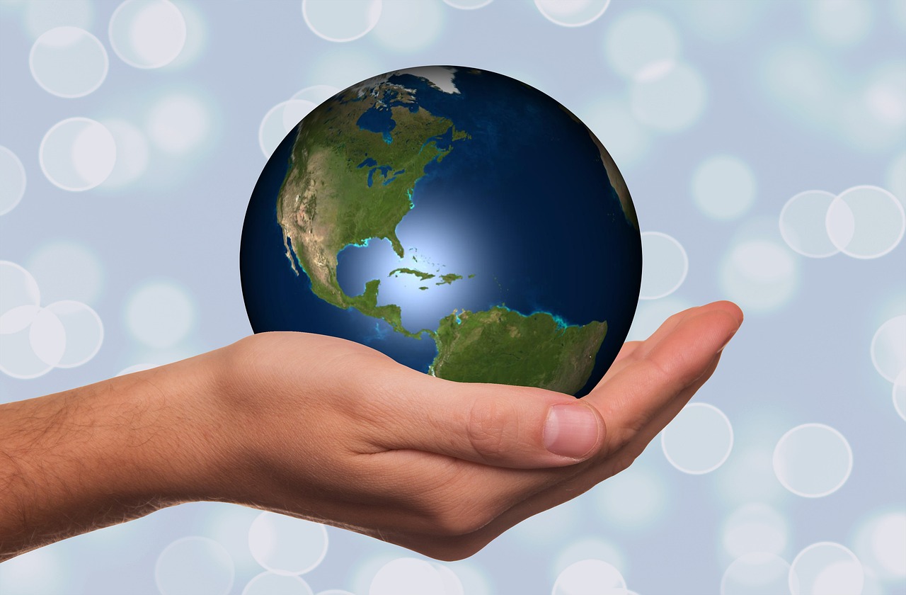 A globe held carefully in an open hand